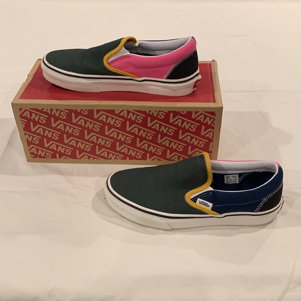 Multi colored vans. Size Women’s 6.5, Men’s 5. Never been worn